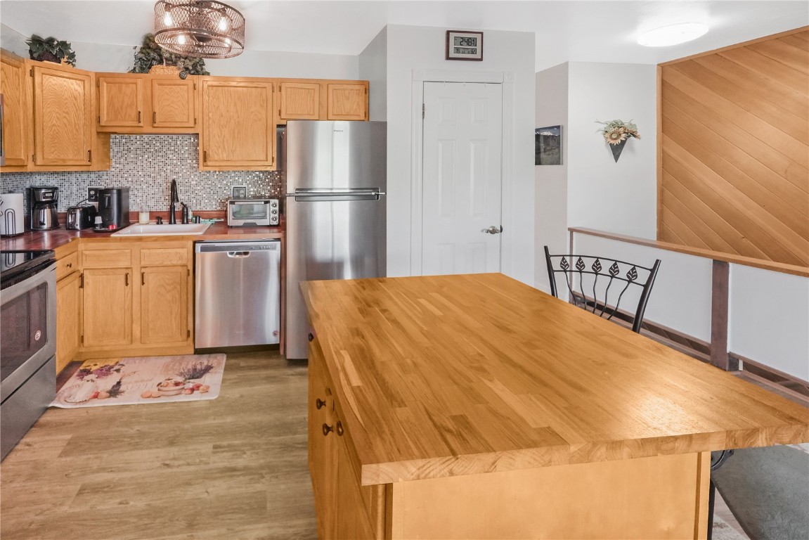 150 Evergreen Road, Unit C303 Dillon, CO 80435 - Photo 10 of 35 a kitchen with a refrigerator a stove a sink and cabinets