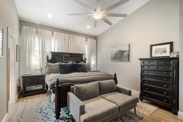 a bedroom with furniture and a closet