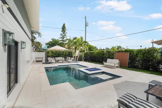 a view of a swimming pool with a lounge chairs
