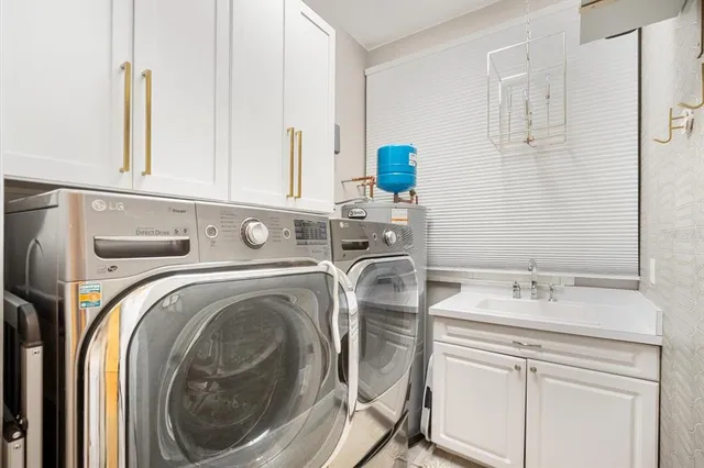 a utility room with dryer and washer