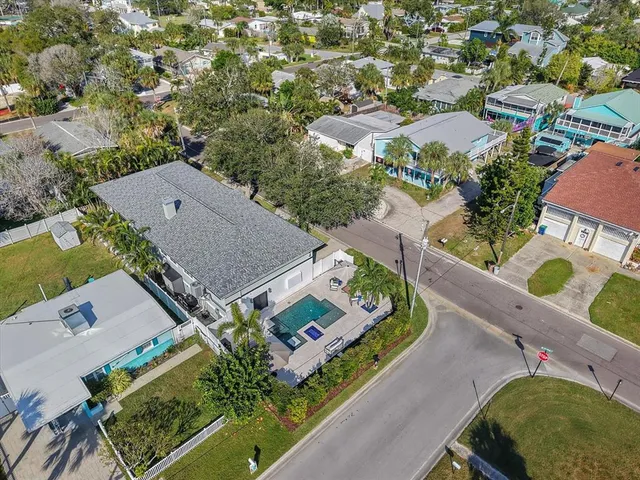 an aerial view of residential houses with outdoor space