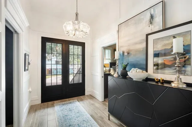 a view of a dining room with furniture and windows