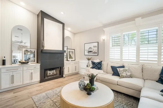 a living room with furniture fireplace and a fireplace