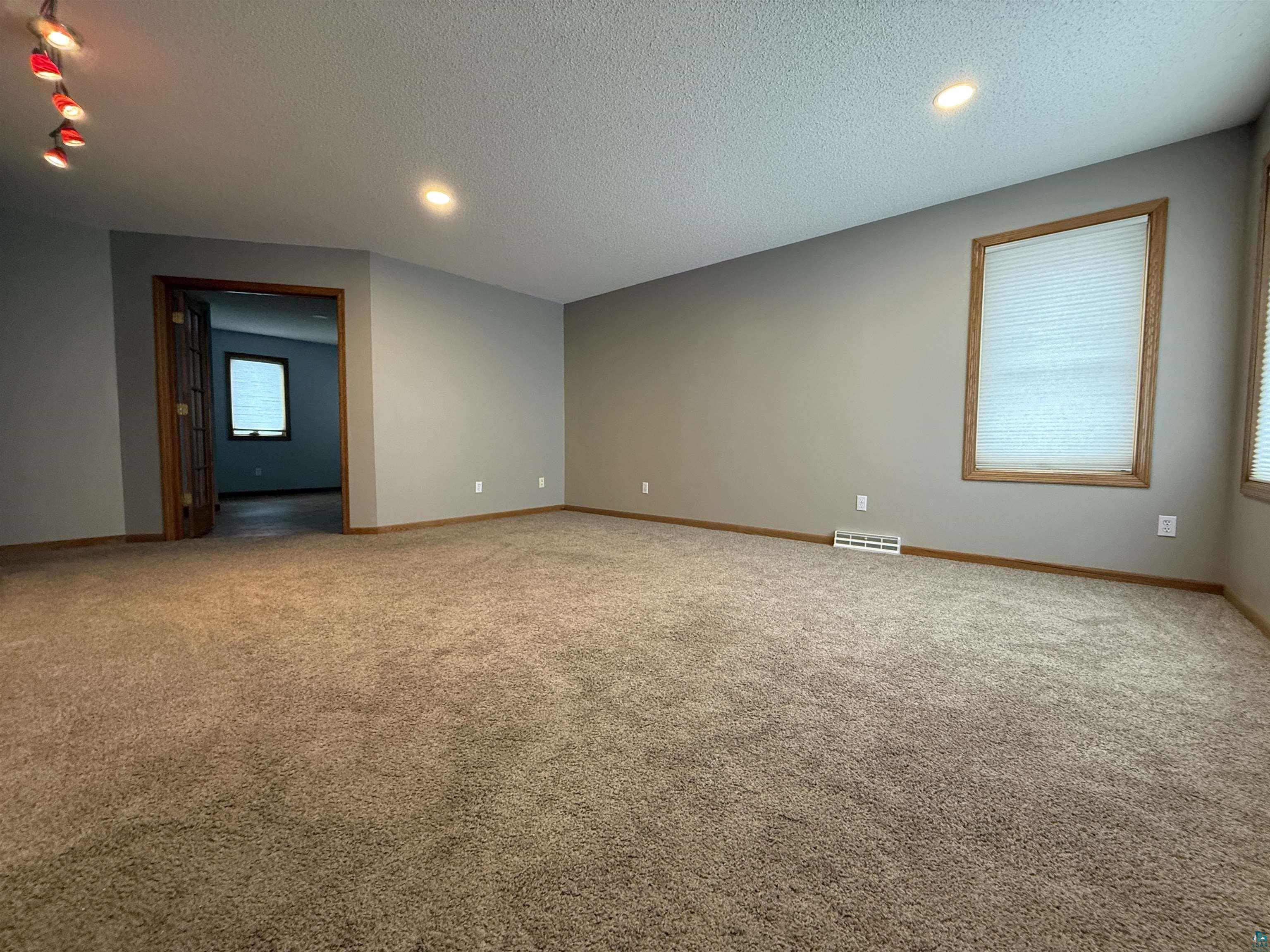 1321 South 13th Street Virginia, MN 55792 - Photo 9 of 33 Unfurnished room featuring carpet floors, a textured ceiling, and recessed lighting