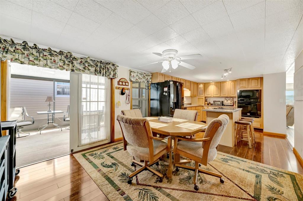 132 West St Lucia Loop Apollo Beach, FL 33572 - Photo 15 of 57 a view of a dining room with furniture and a table
