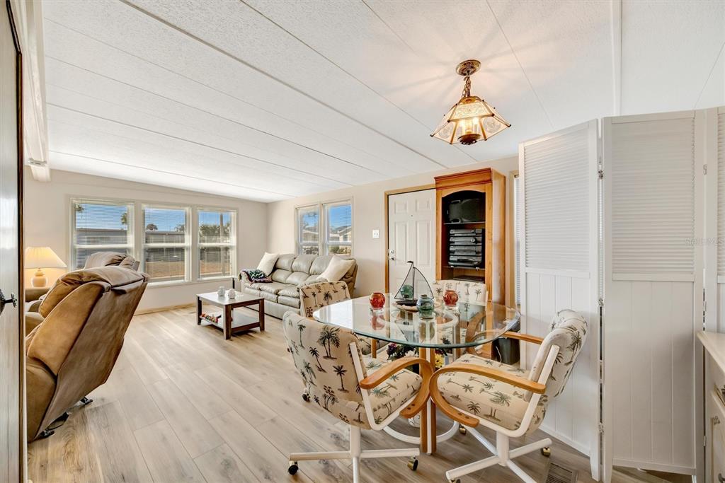 132 West St Lucia Loop Apollo Beach, FL 33572 - Photo 16 of 57 a living room with furniture fireplace and dining table