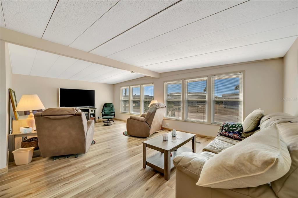132 West St Lucia Loop Apollo Beach, FL 33572 - Photo 19 of 57 a living room with furniture and a flat screen tv