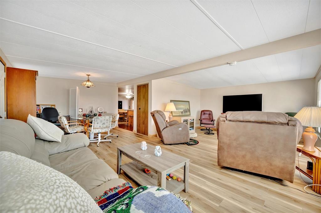 132 West St Lucia Loop Apollo Beach, FL 33572 - Photo 20 of 57 a living room with furniture and a flat screen tv