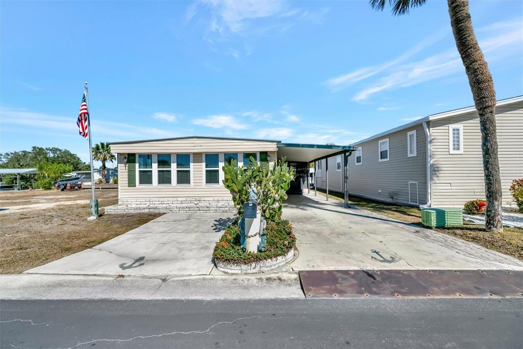 132 West St Lucia Loop Apollo Beach, FL 33572 - Photo 2 of 57 a front view of a house with garden