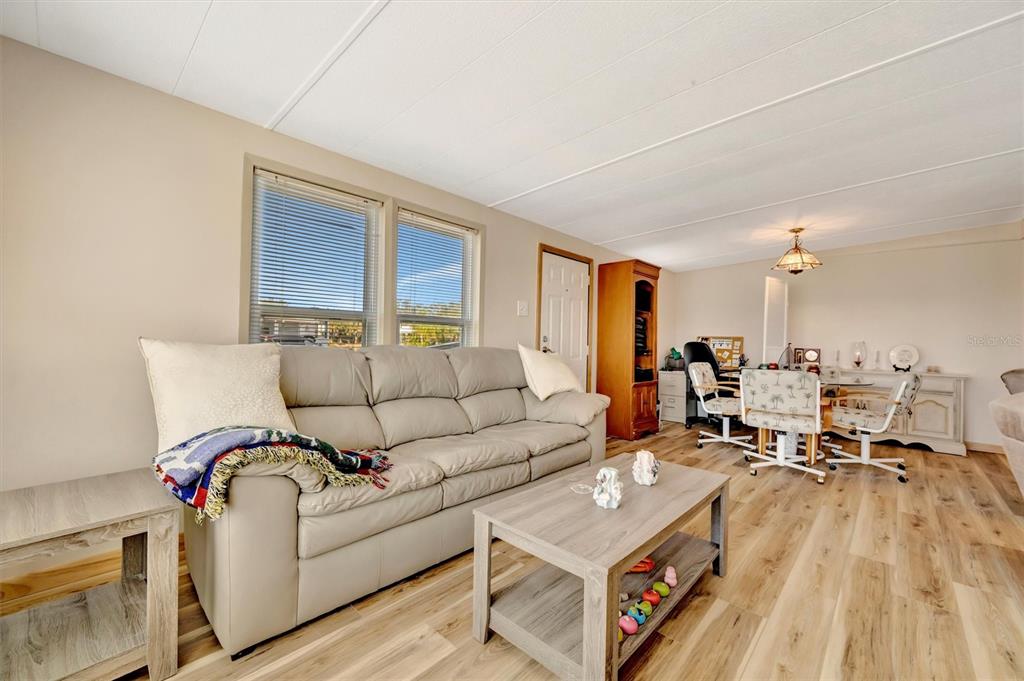 132 West St Lucia Loop Apollo Beach, FL 33572 - Photo 21 of 57 a living room with furniture and a table