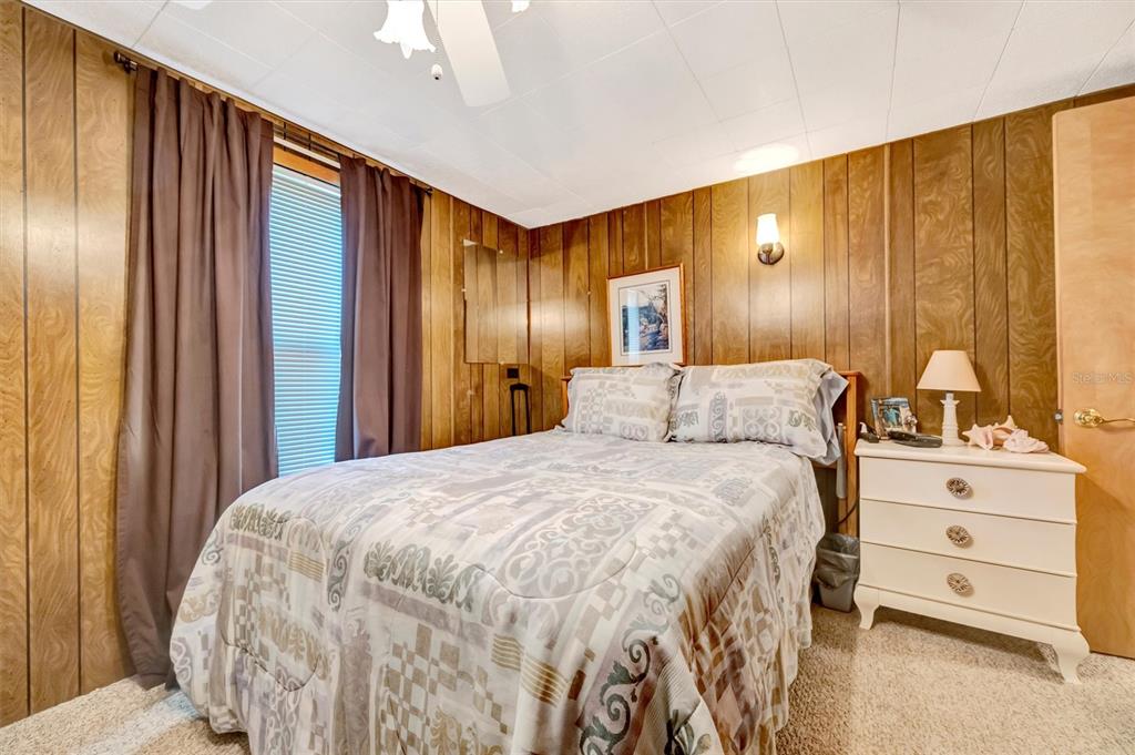 132 West St Lucia Loop Apollo Beach, FL 33572 - Photo 26 of 57 a bedroom with a bed and a dresser