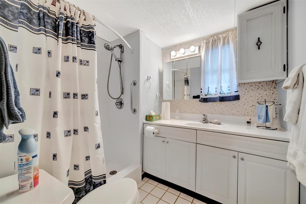 132 West St Lucia Loop Apollo Beach, FL 33572 - Photo 28 of 57 a bathroom with double vanity sink a mirror a vanity and a shower