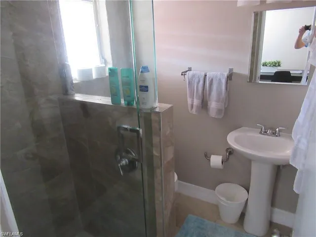 a bathroom with a sink and toilet