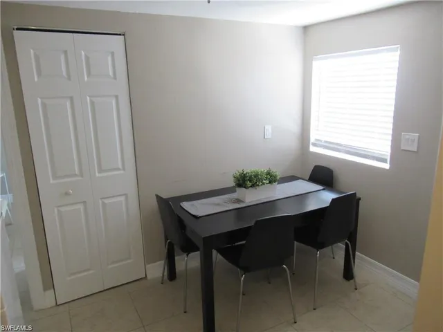 a view of a workspace with furniture