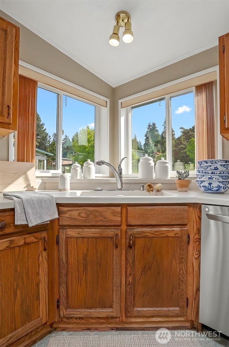 905 243rd Street Southwest Bothell, WA 98021 - Photo 6 of 37 a kitchen with stainless steel appliances granite countertop a stove a sink and a granite counter top