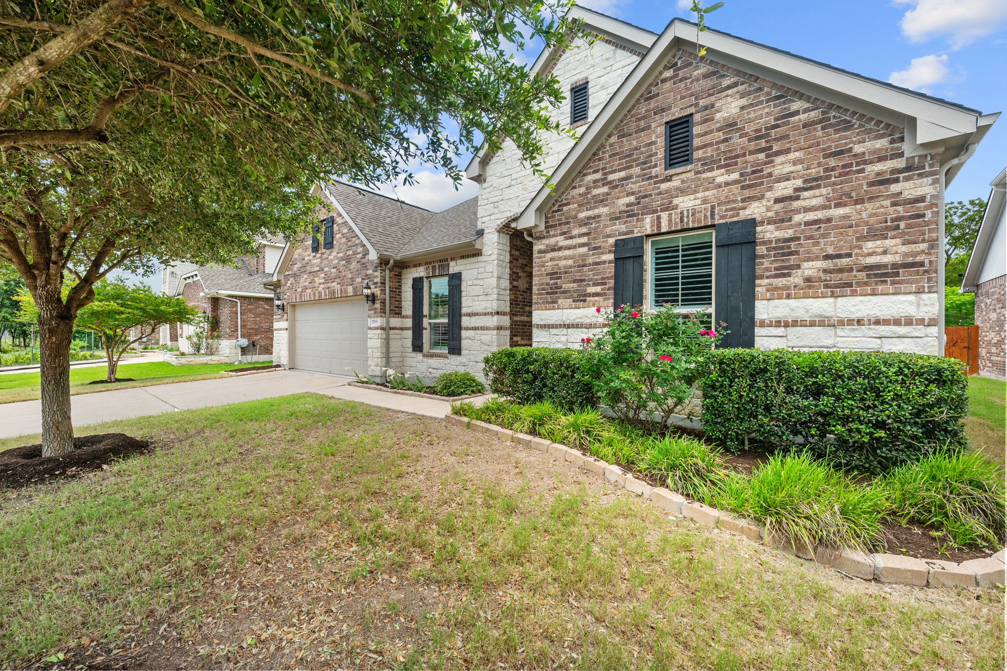 2709 Steece Way Leander, TX 78641 - Photo 2 of 39 a view of a white house next to a yard with large trees