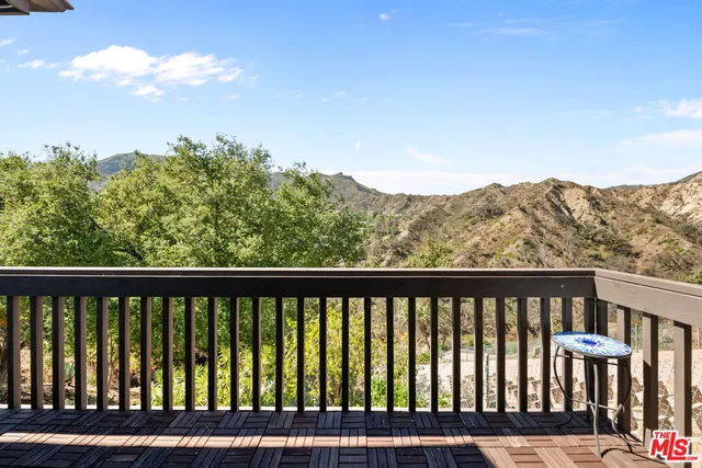 a bathroom with a sink vanity and a toilet