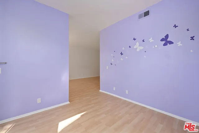 a bathroom with a double vanity sink mirror and shower
