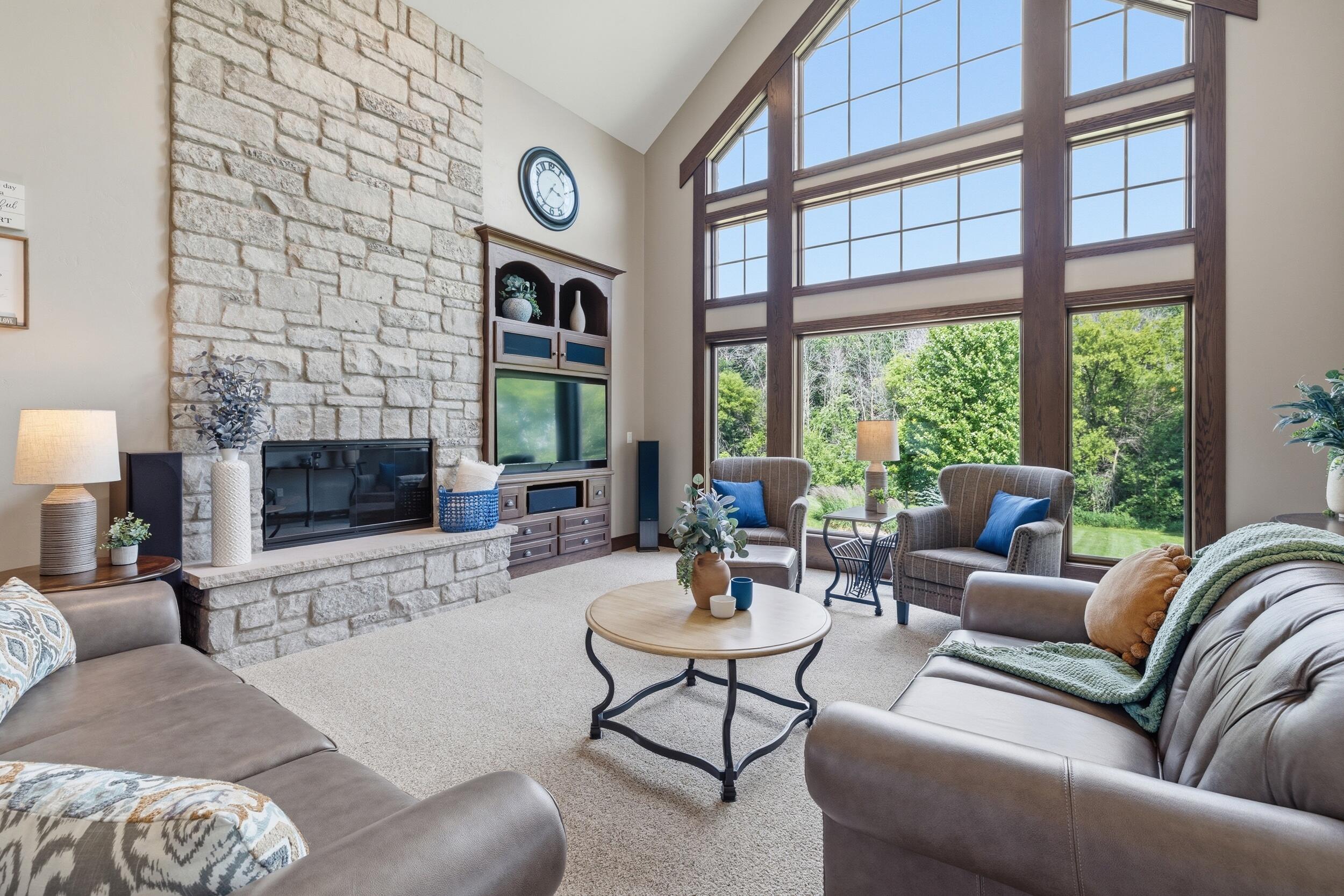 11105 Meadow Ridge Road Whitelaw, WI 54247 - Photo 20 of 78 Stone Fireplace Hearth plus Vaulted Full View Windows