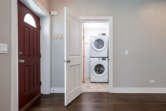 a view of a storage and utility room with washer and dryer