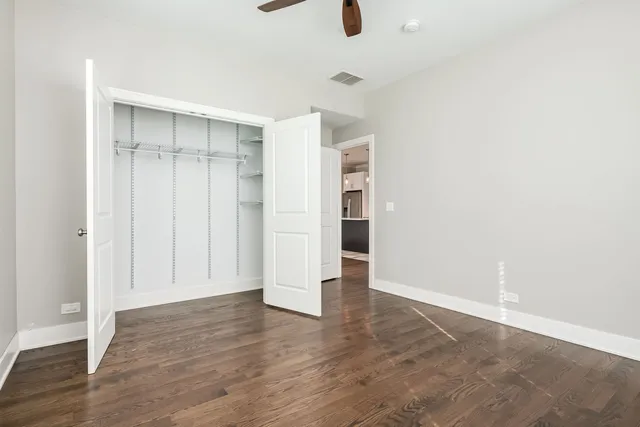 an empty room with wooden floor