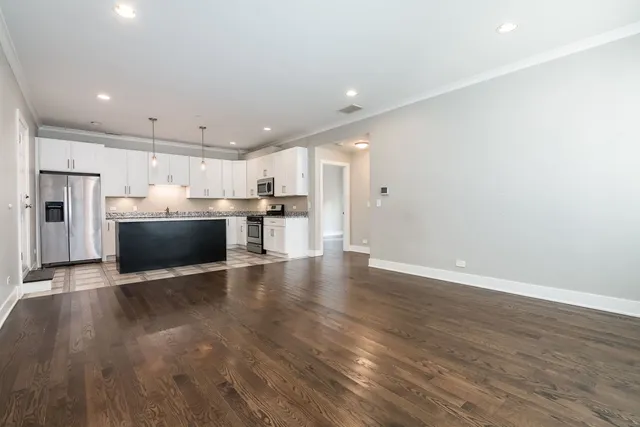 a view of a kitchen with a sink and a stove top oven