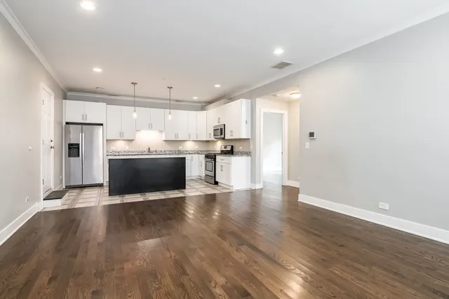 a view of kitchen with wooden floor
