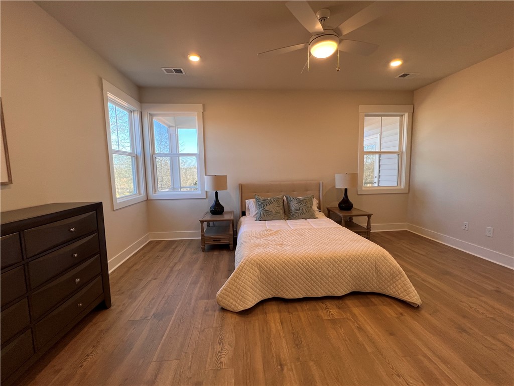130 Tiger Lily Drive Anderson, SC 29621 - Photo 11 of 27 This inviting bedroom features laminate hardwood flooring and abundant natural light.