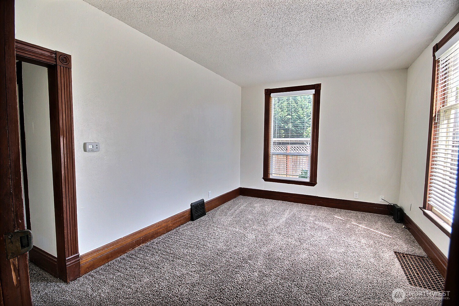 414 Sumner Avenue Sumner, WA 98390 - Photo 13 of 22 an empty room with windows