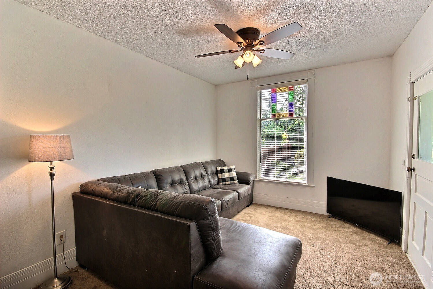 414 Sumner Avenue Sumner, WA 98390 - Photo 6 of 22 a living room with furniture and a window