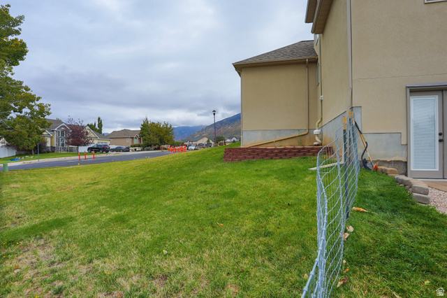 426 Deer Hollow Road Tooele, UT 84074 - Photo 34 of 37 View of grassy yard featuring a mountain view