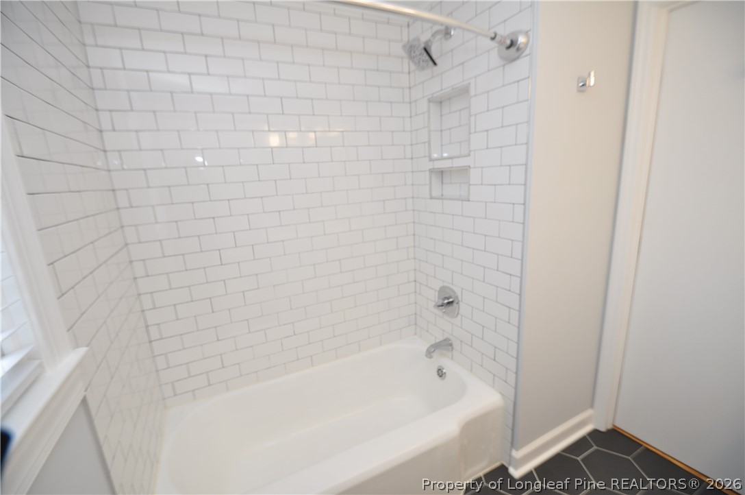 1008 Nichols Drive Raleigh, NC 27605 - Photo 31 of 33 a bathroom with a bathtub