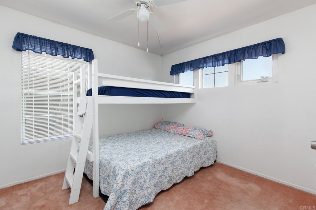 305 Cobblestone Place Santee, CA 92071 - Photo 17 of 36 a bedroom with a bed and a window