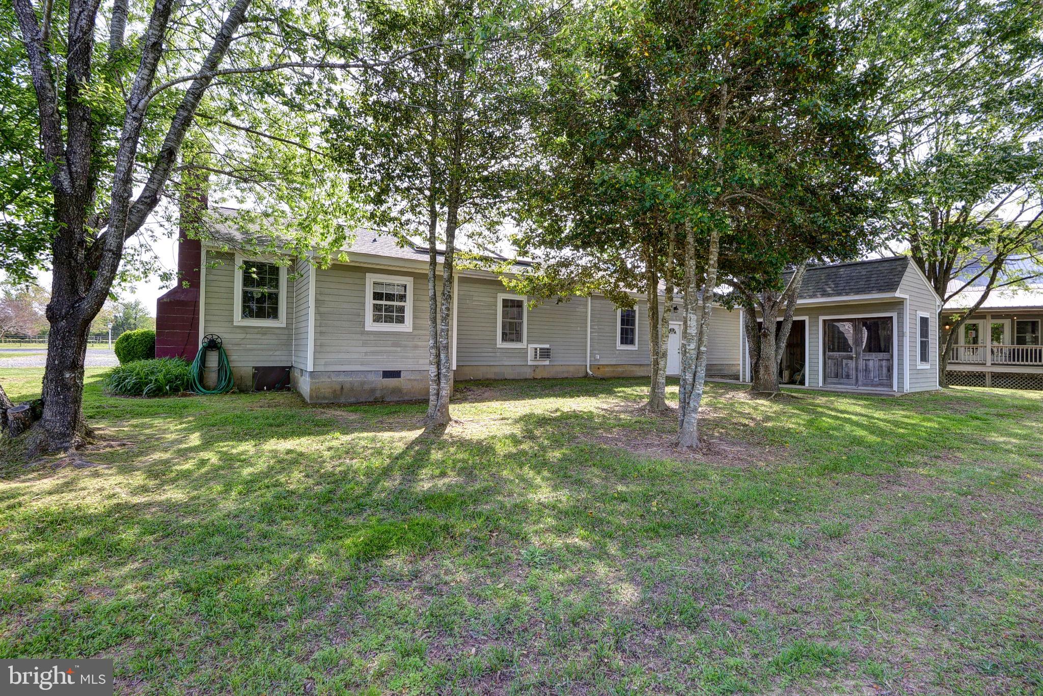 1025 Goodluck Road Lancaster, VA 22503 - Photo 113 of 132 a backyard of a house with seating space