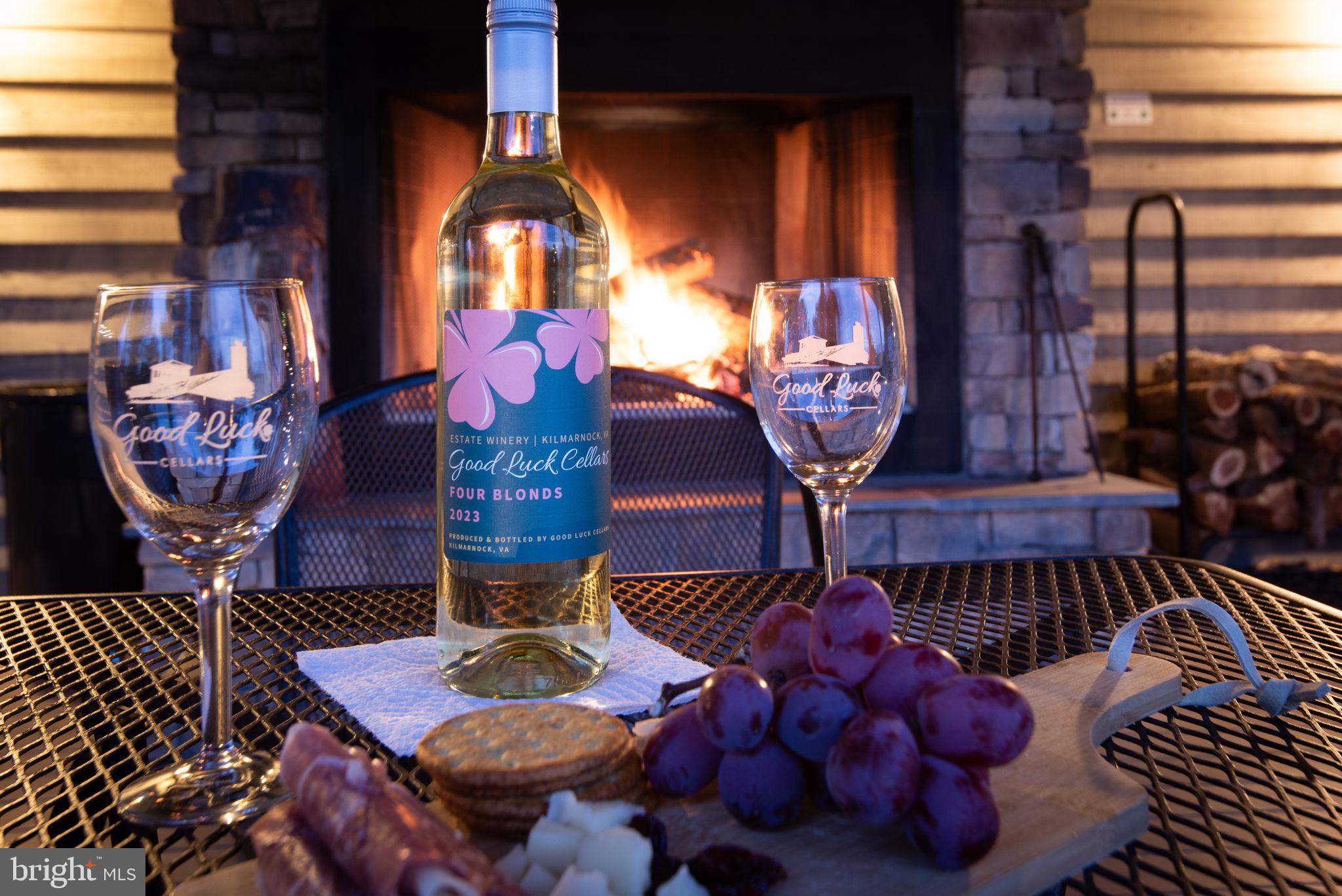 1025 Goodluck Road Lancaster, VA 22503 - Photo 13 of 132 a table with wine bottles and glasses on it