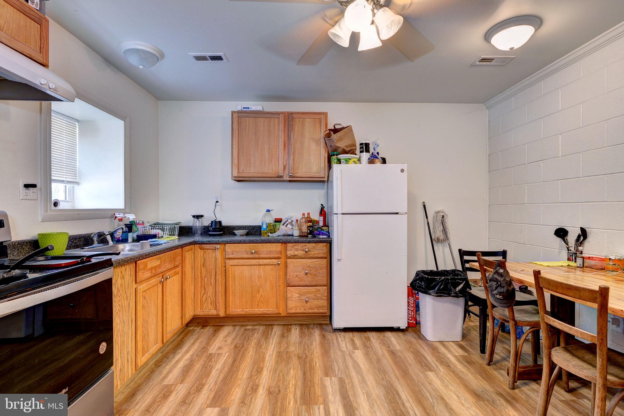 1025 Goodluck Road Lancaster, VA 22503 - Photo 132 of 132 a kitchen with stainless steel appliances granite countertop a refrigerator sink and white cabinets
