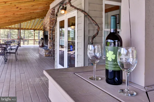 a bedroom with furniture and large windows