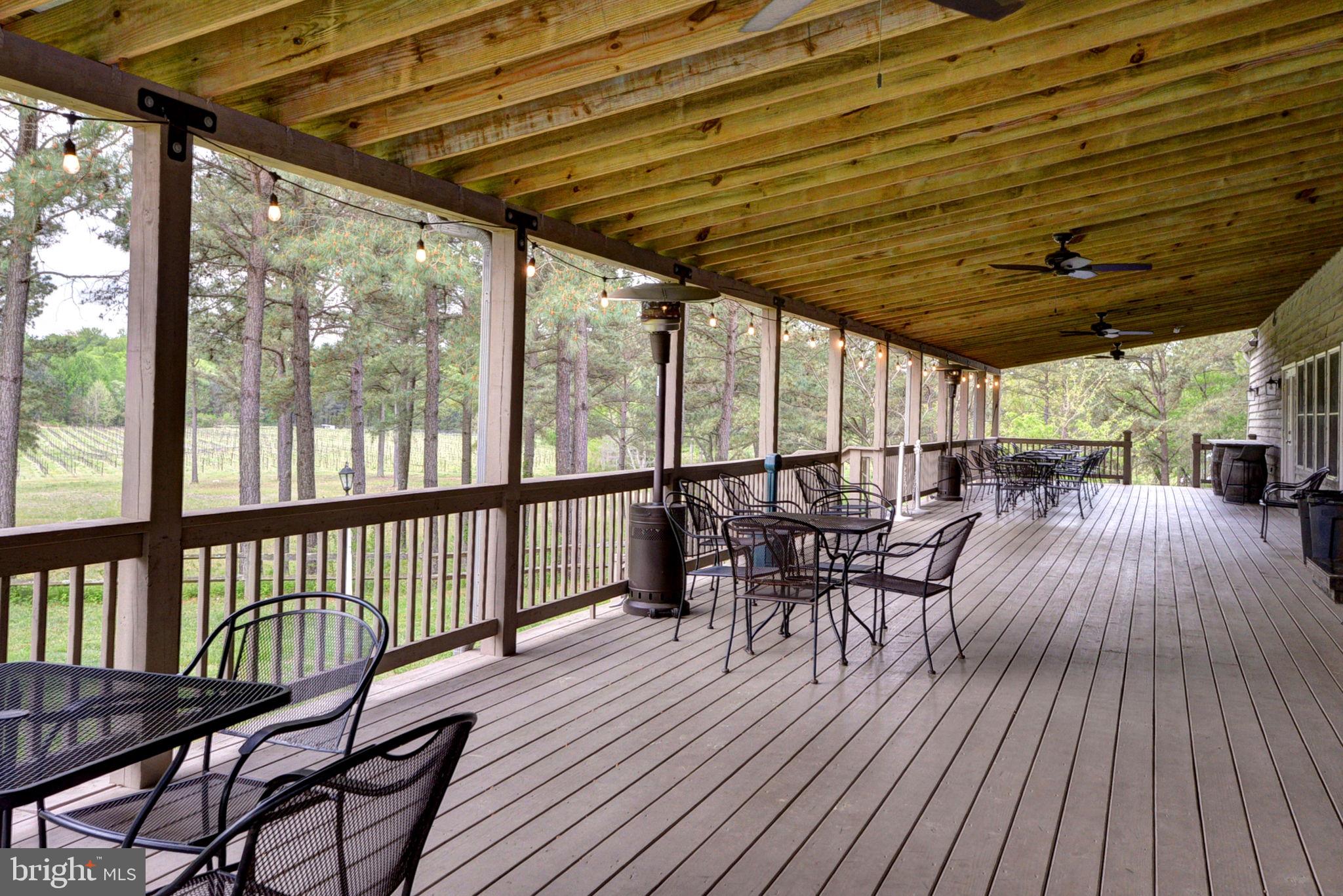 1025 Goodluck Road Lancaster, VA 22503 - Photo 33 of 132 a view of a chairs and table on the wooden floor