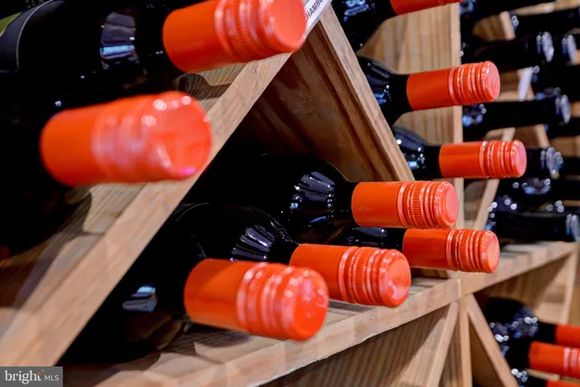 a view of a patio with dining table and chairs with wooden floor