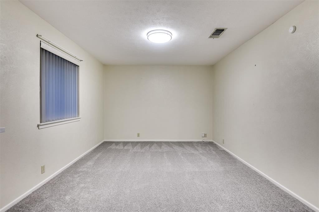 802 Cardinal Road Mansfield, TX 76063 - Photo 11 of 31 Unfurnished room with light carpet and a textured ceiling