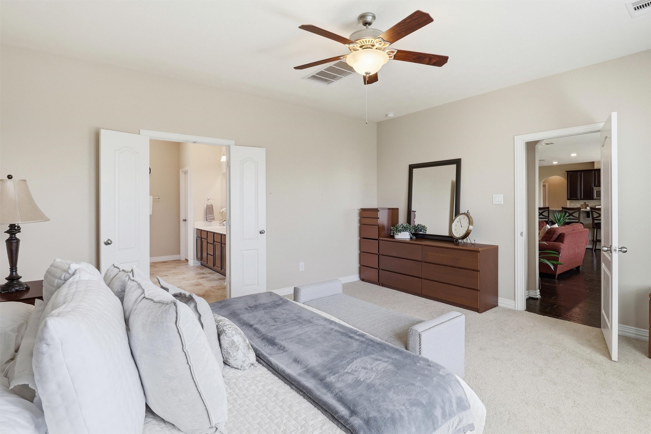 3219 Cotton Ranch Drive Katy, TX 77494 - Photo 17 of 45 Spacious and inviting, this private retreat offers room for oversized furnishings as well as a cozy sitting area or reading nook. Double doors lead to the spa-inspired ensuite bathroom, enhancing the suite's sense of comfort and privacy.