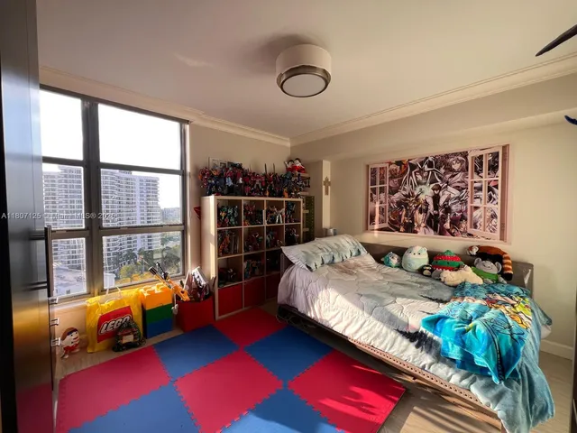 a bedroom with bed and a window