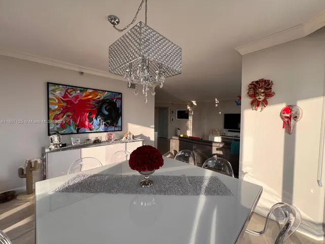 a view of a living room and dining room