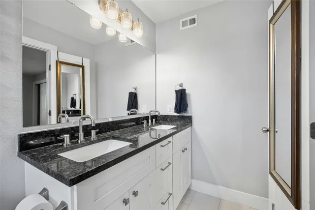 a bathroom with a toilet and shower