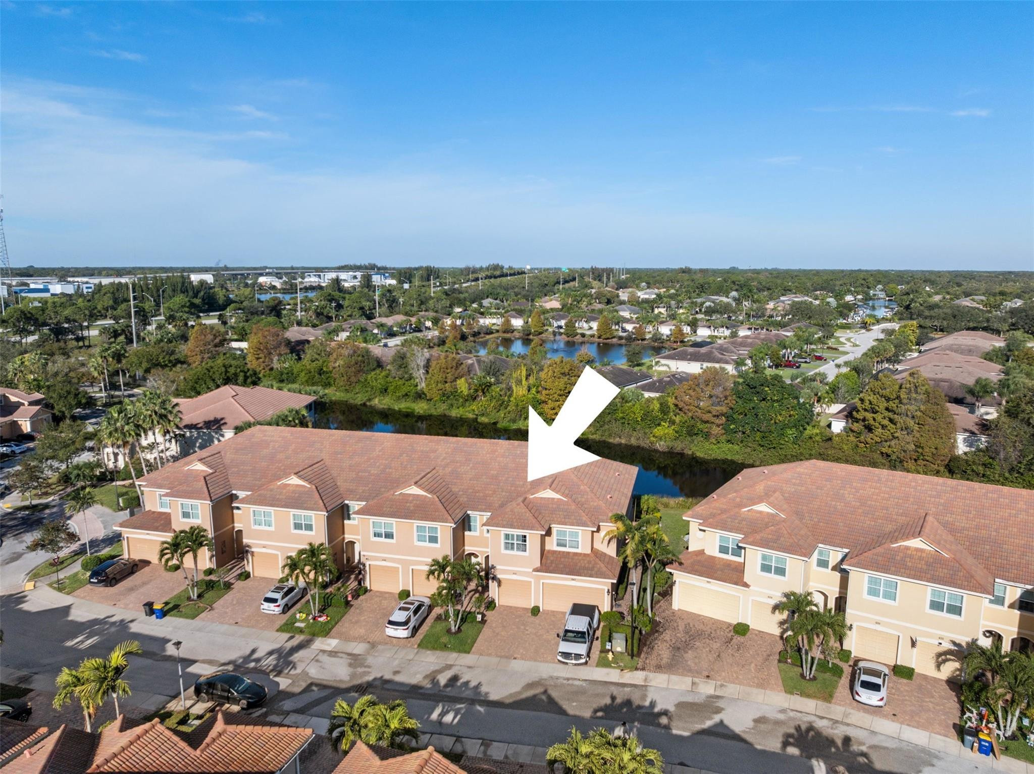 651 Southwest Glen Crest Way, Unit 2 Stuart, FL 34997 - Photo 30 of 41 an aerial view of residential houses with outdoor space