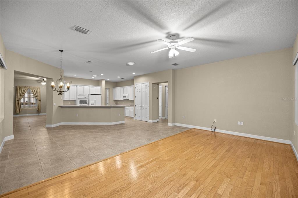 9512 Southeast 124th Loop Summerfield, FL 34491 - Photo 17 of 76 a view of an empty room and kitchen view