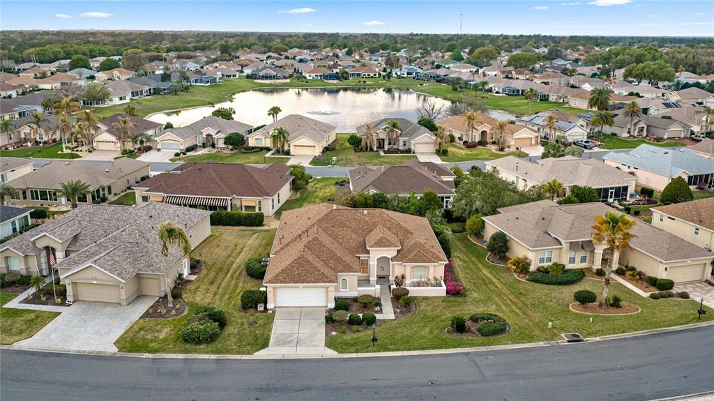 9512 Southeast 124th Loop Summerfield, FL 34491 - Photo 2 of 76 an aerial view of residential houses with outdoor space