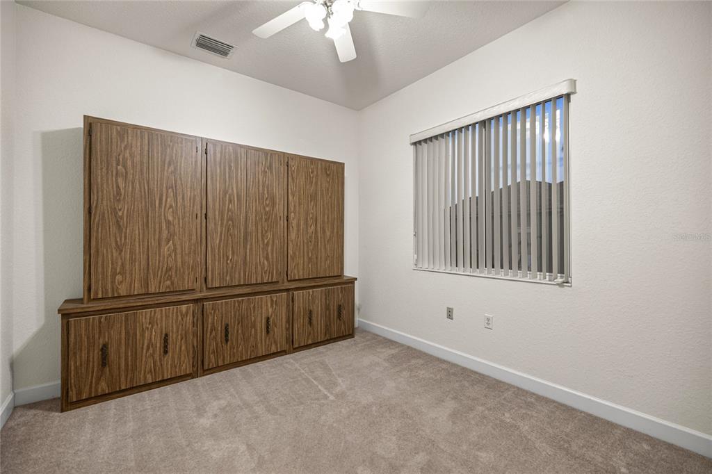 9512 Southeast 124th Loop Summerfield, FL 34491 - Photo 22 of 76 an empty room with windows