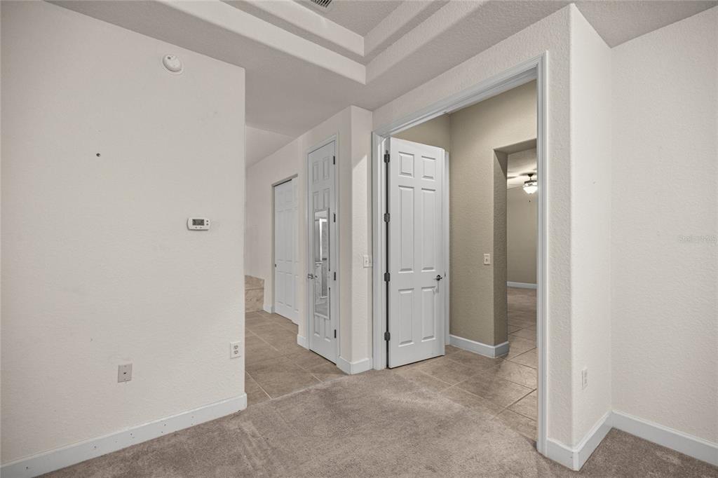 9512 Southeast 124th Loop Summerfield, FL 34491 - Photo 26 of 76 a view of a hallway with closet and wooden floor