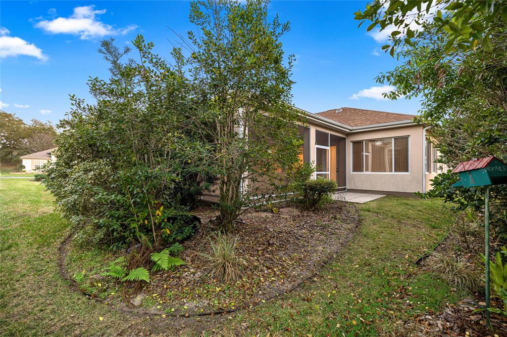 9512 Southeast 124th Loop Summerfield, FL 34491 - Photo 32 of 76 a view of a house with a yard
